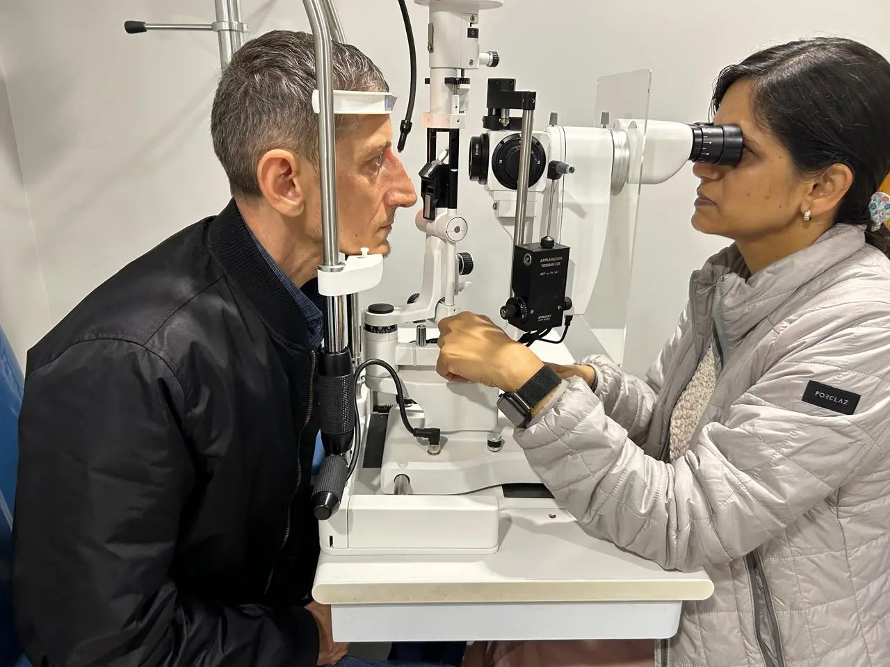 Dr. Nidhi Gupta carefully examining a patient at Delhi Eye Care