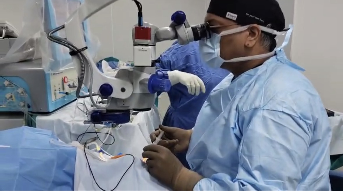 Dr Shashank Rai Gupta performing vitreoretinal surgery at the operating microscope