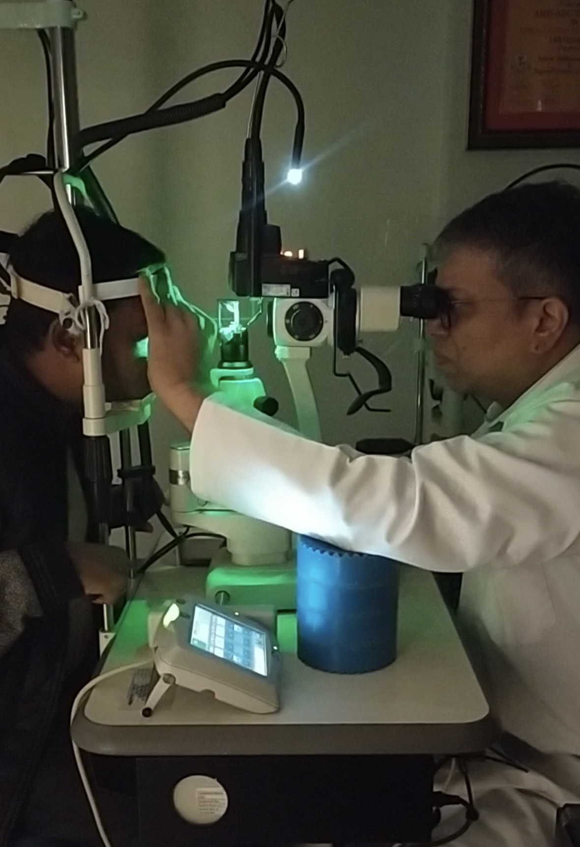 Dr Shashank Rai Gupta performing green retinal laser treatment at the slit lamp